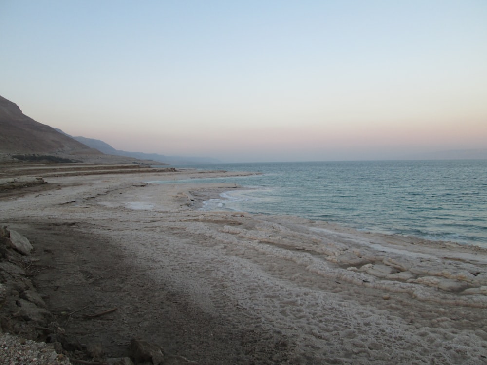 a beach with rocks and water