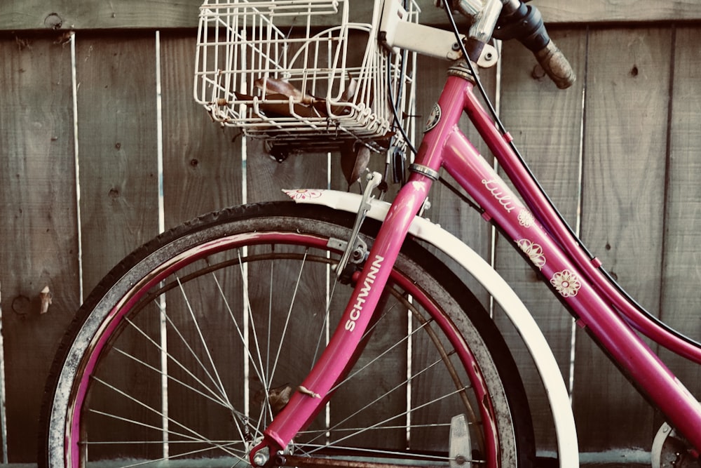 a bicycle with a basket on the front wheel