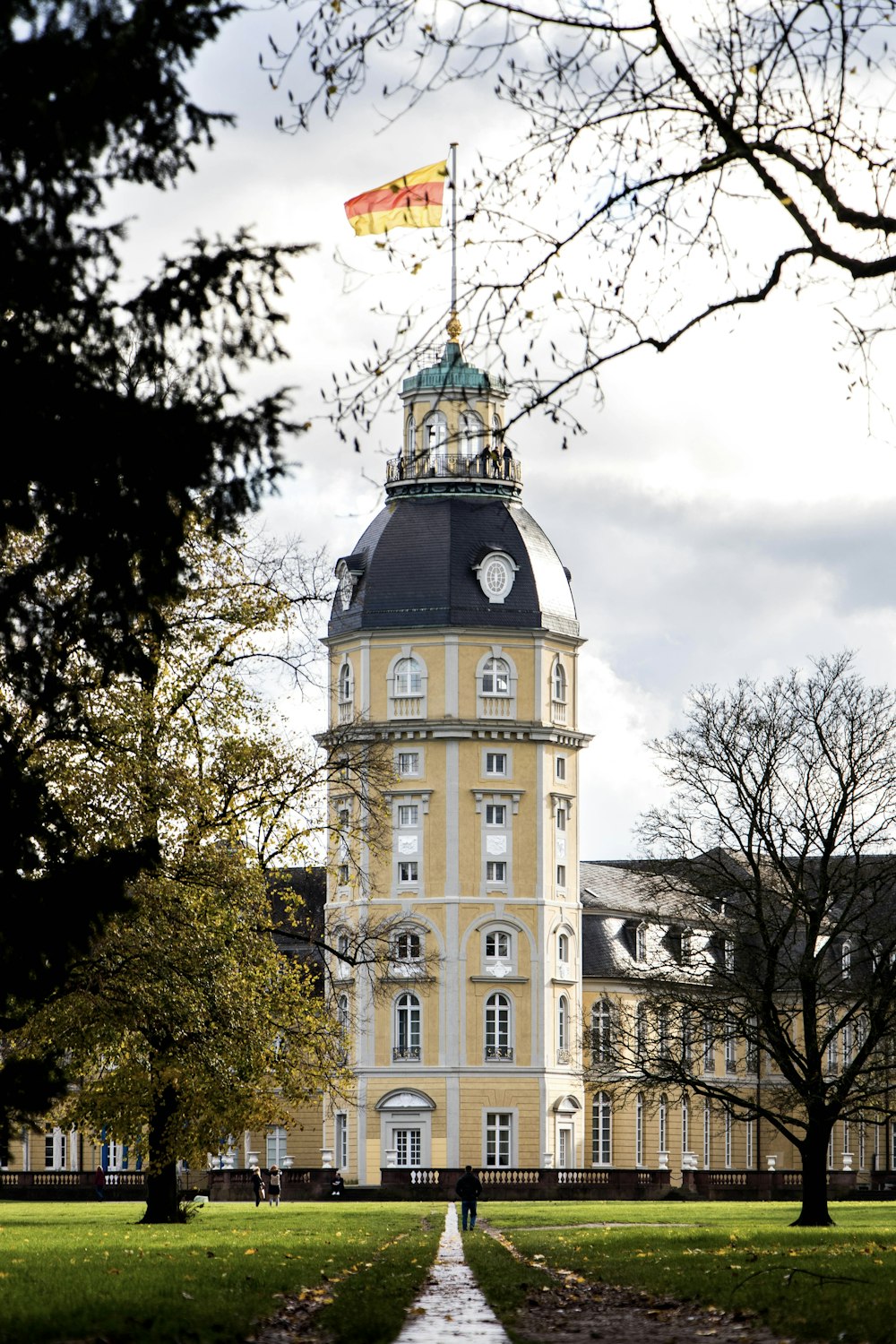 a flag flying in front of a building