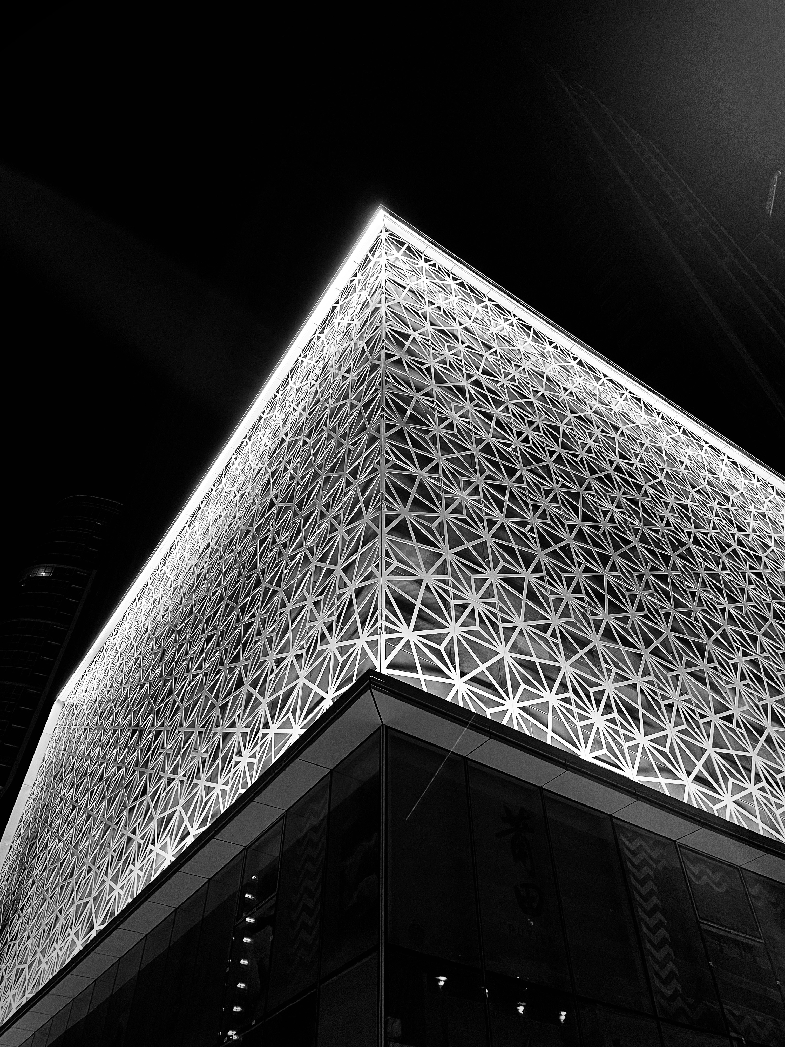 a tall building with a glass front