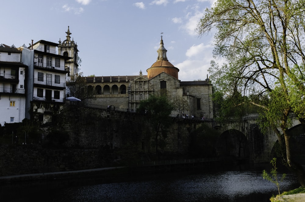 a stone wall with a building on top of it