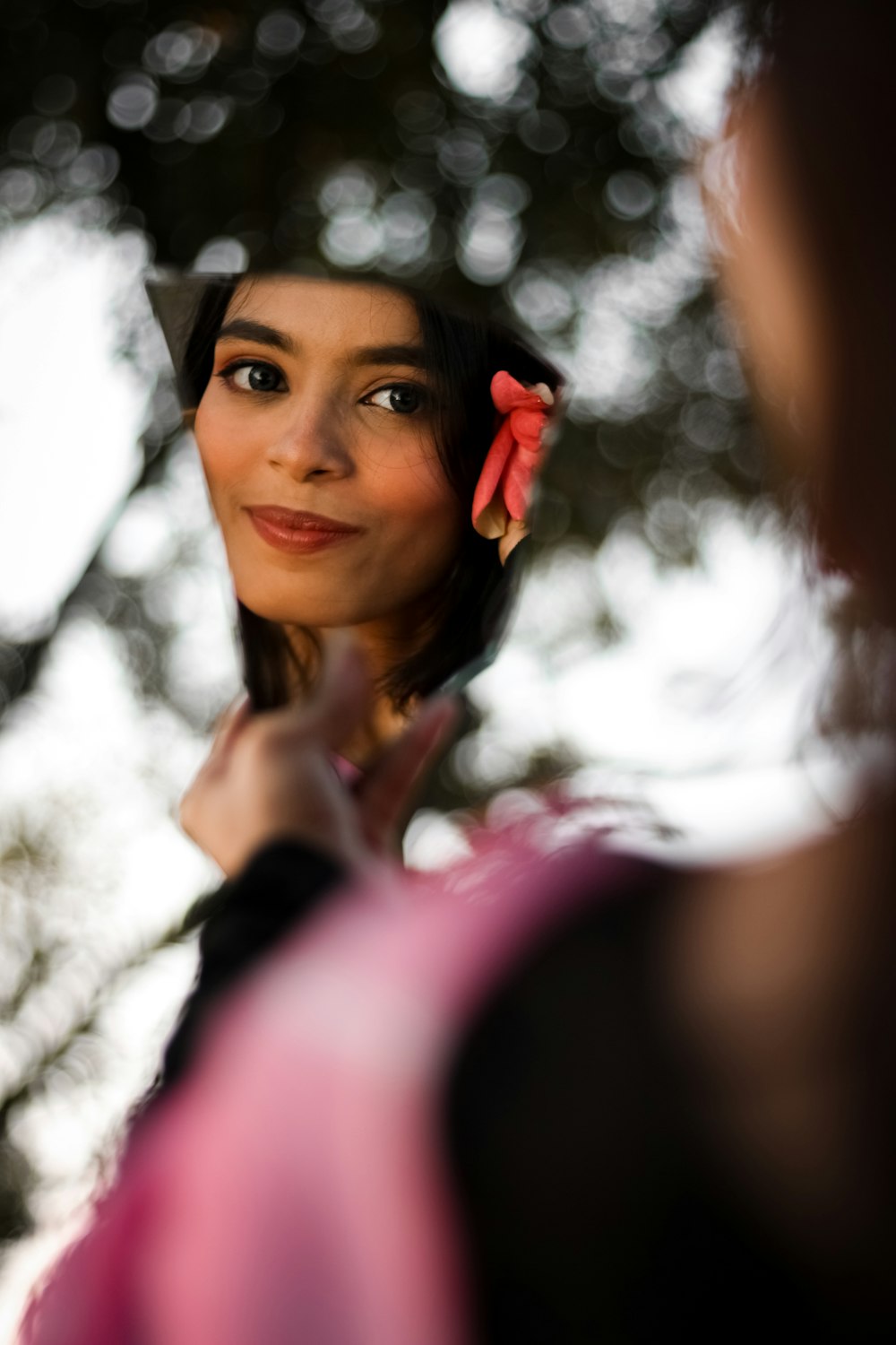 a woman with a flower in her hair