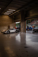 The exterior of NRA Garage with cars parked outside on a sunny day.
