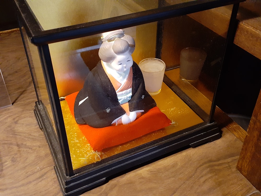 a figurine on a tray