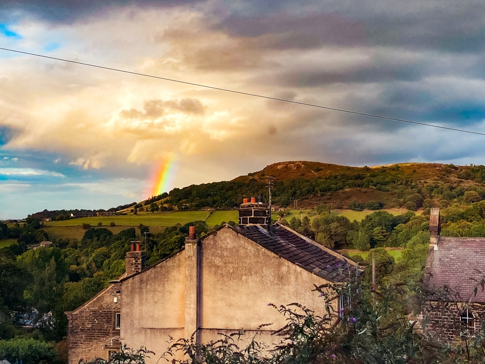 a rainbow over a hill