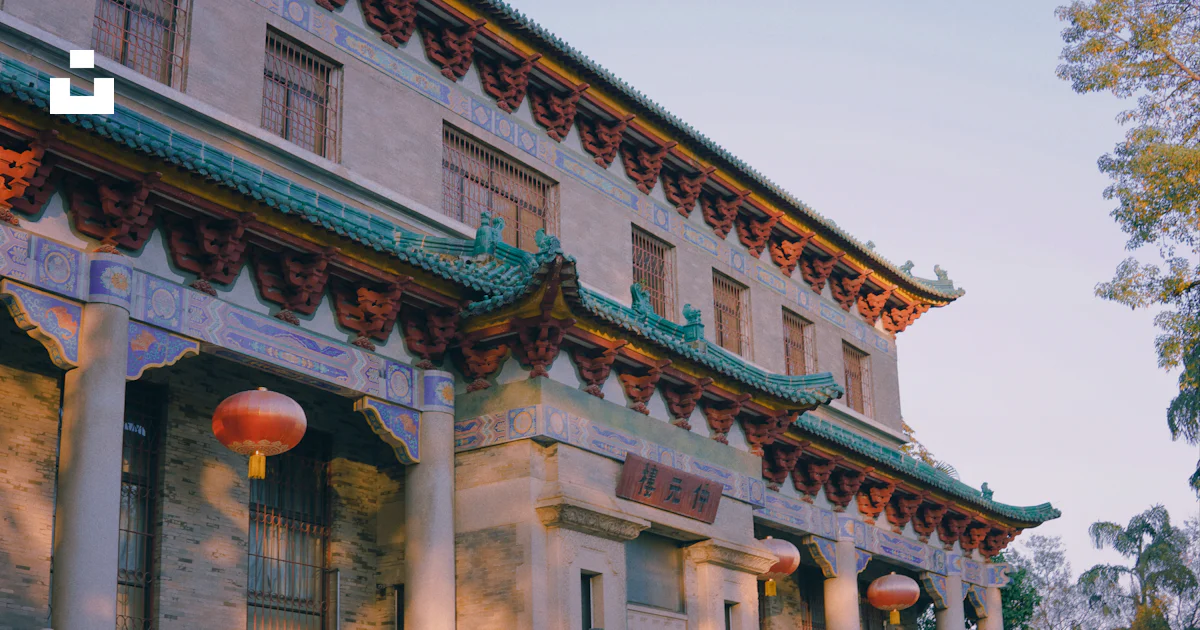 A building with columns and a large red ball in front photo – Free 中国 ...