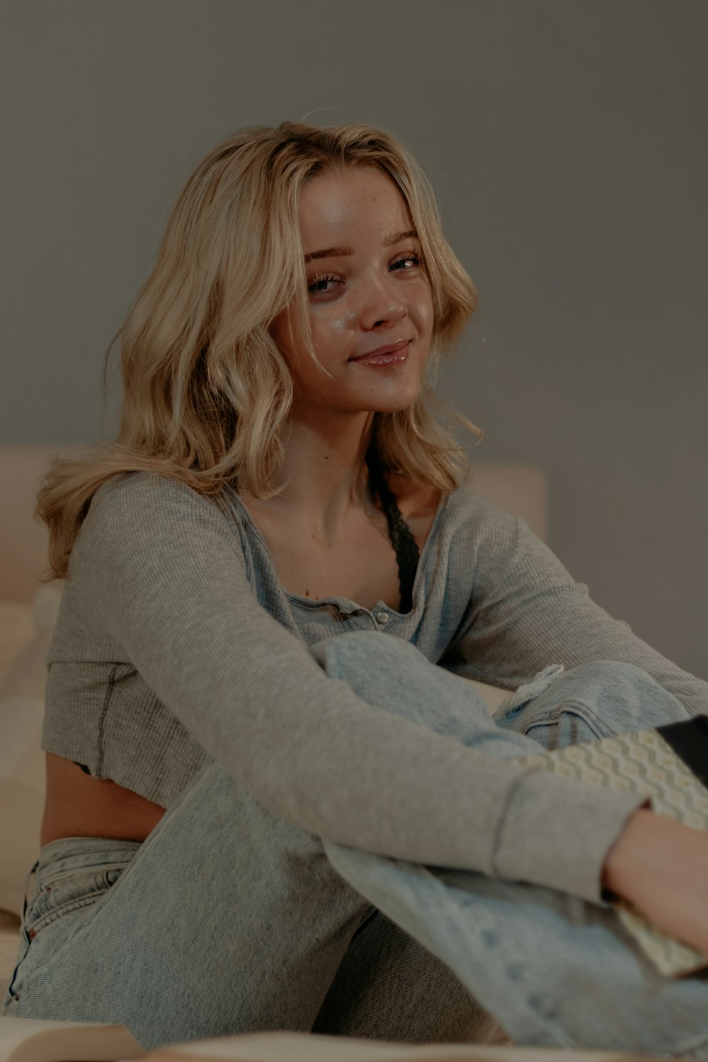 a woman sitting on a couch