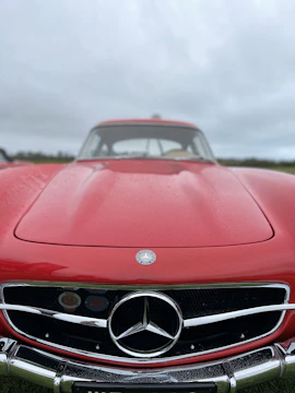 Mercedes Benz with a newly fitted aggressive front bumper and stylish fog lights on a sunny day.