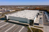 Industrial warehouse with large loading docks under clear sky