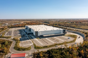 a large building with a parking lot