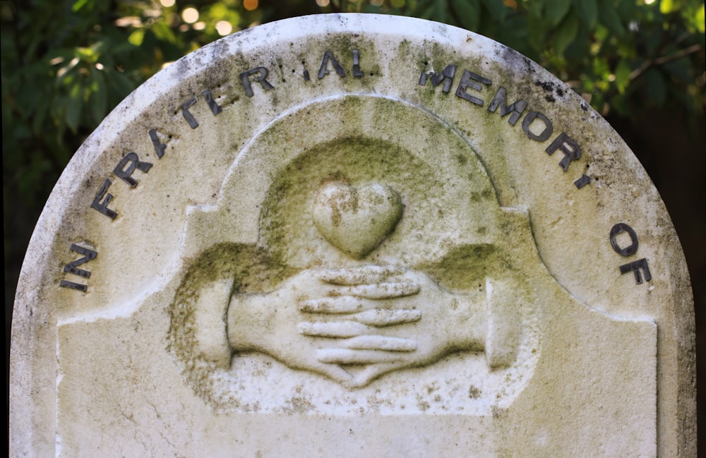 a stone with a face carved into it