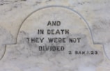 a close up of a memorial with a quote on it
