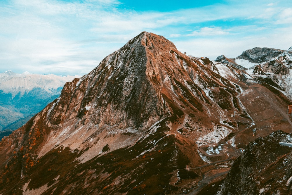 a rocky mountain with snow