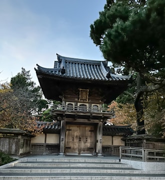 Entrance gate of a peaceful spiritual housing community with traditional design.