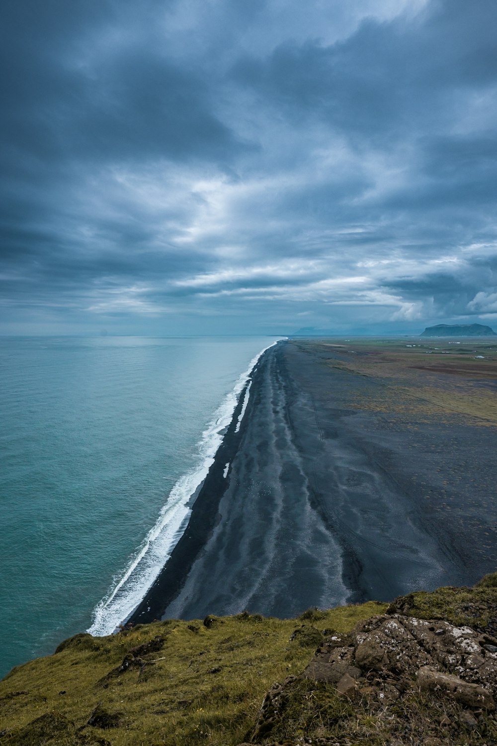 a beach with a body of water