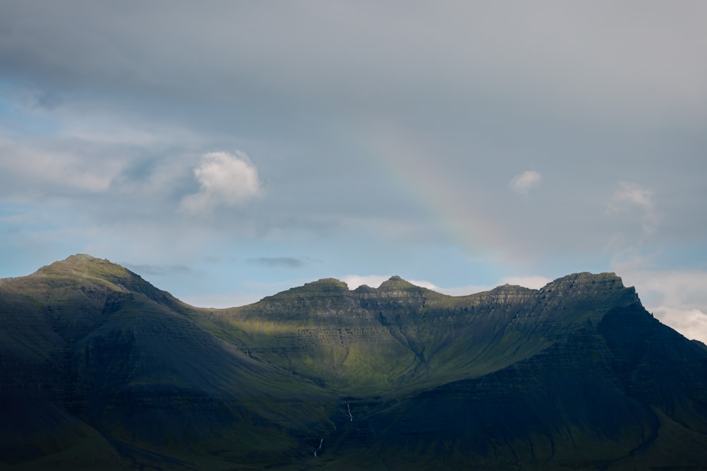 a mountain range with clouds