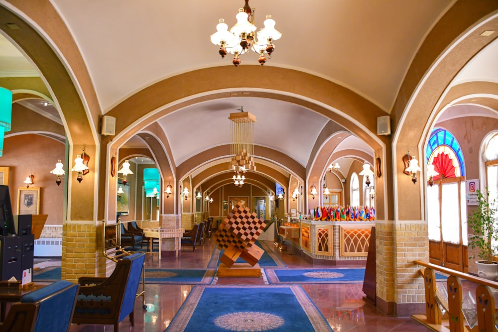 a large room with a chandelier and chairs