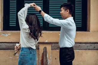 a man and a woman holding hands