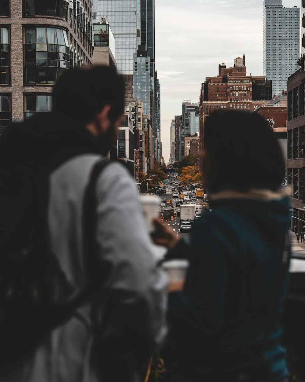 a group of people standing in a city