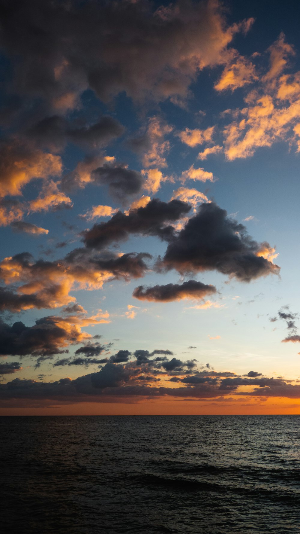 a sunset over a body of water