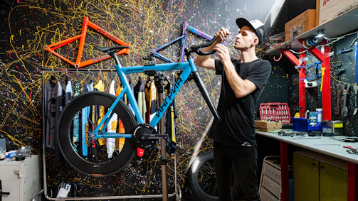 a man working on a bicycle