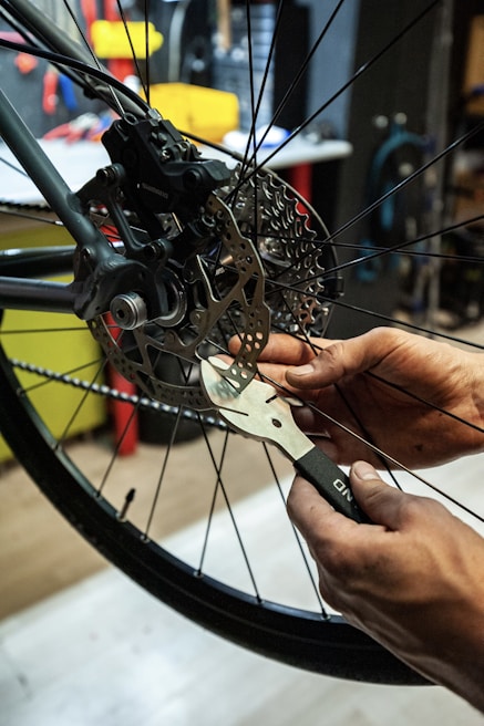 Technicians inspecting a truck's brake system.