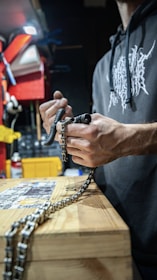 a man holding a chain
