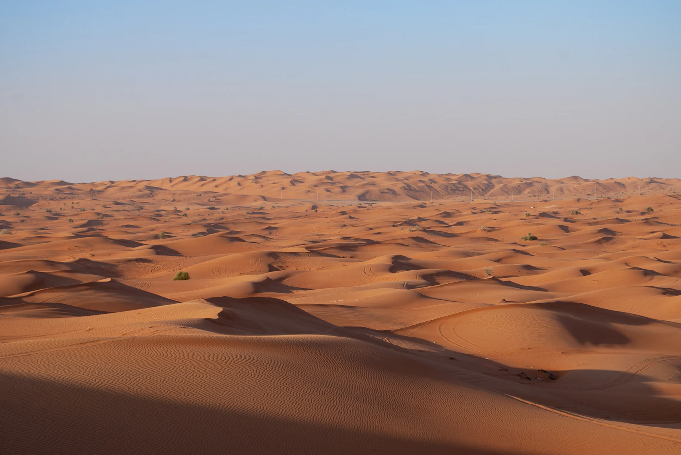 Sculpted golden sand dunes in the Dubai desert