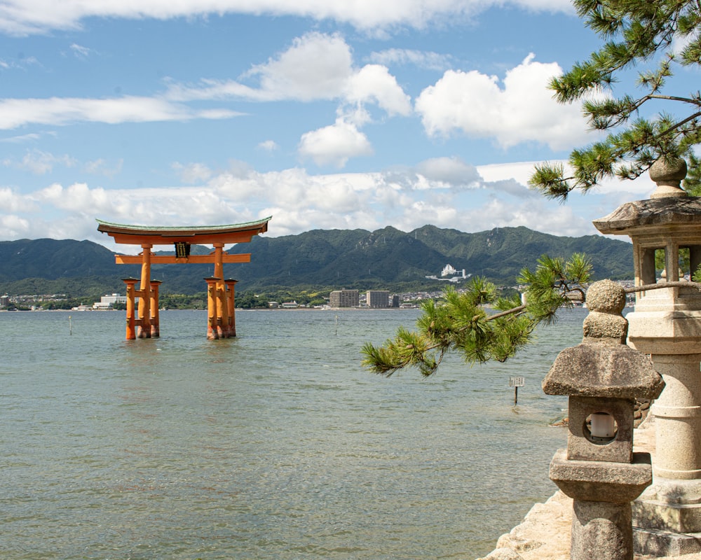 a wooden structure in the middle of a body of water