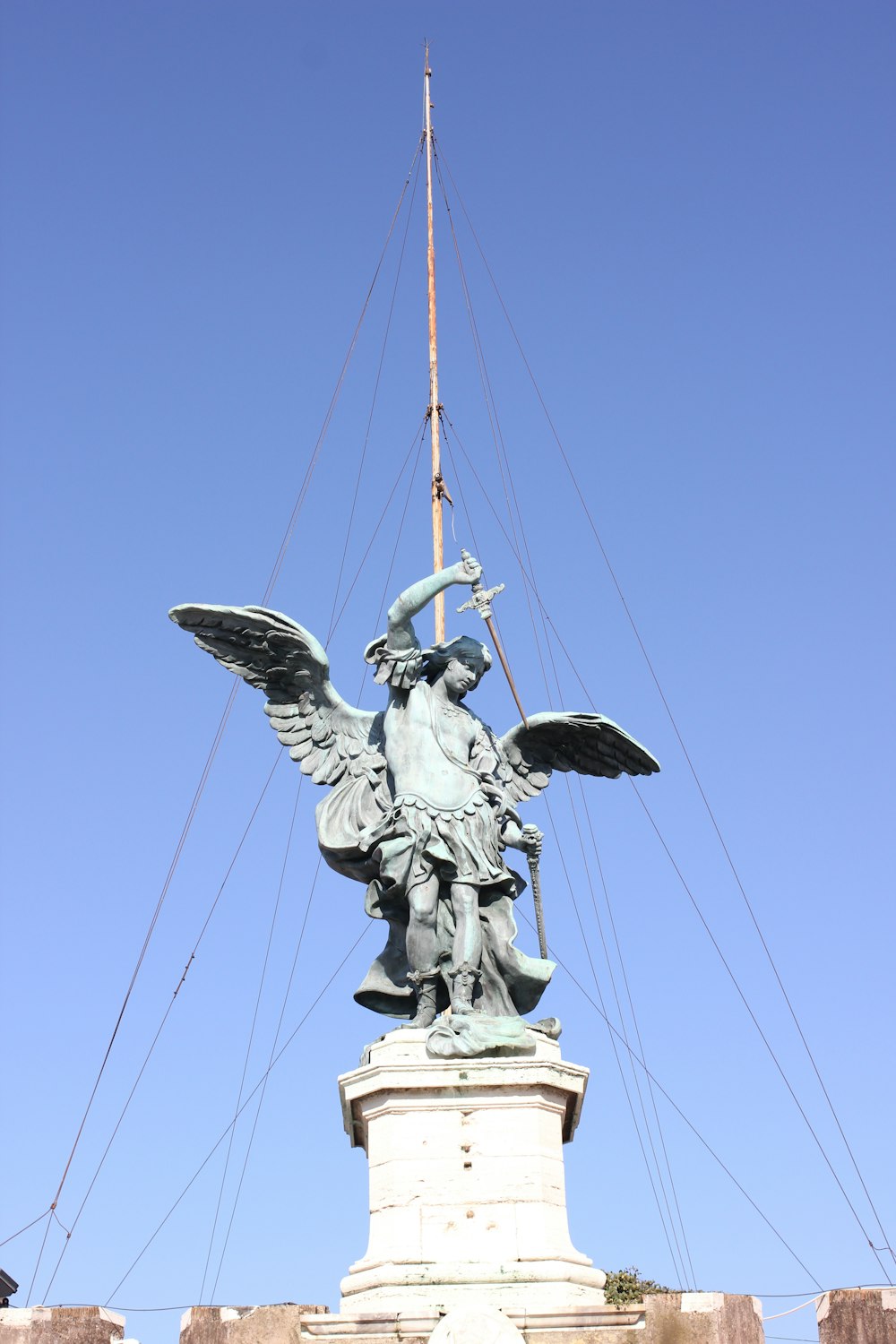 a statue of a person holding a bird