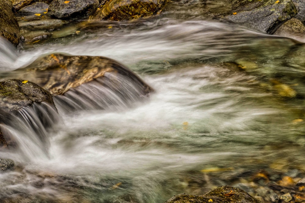 a river with rocks and water flowing over it