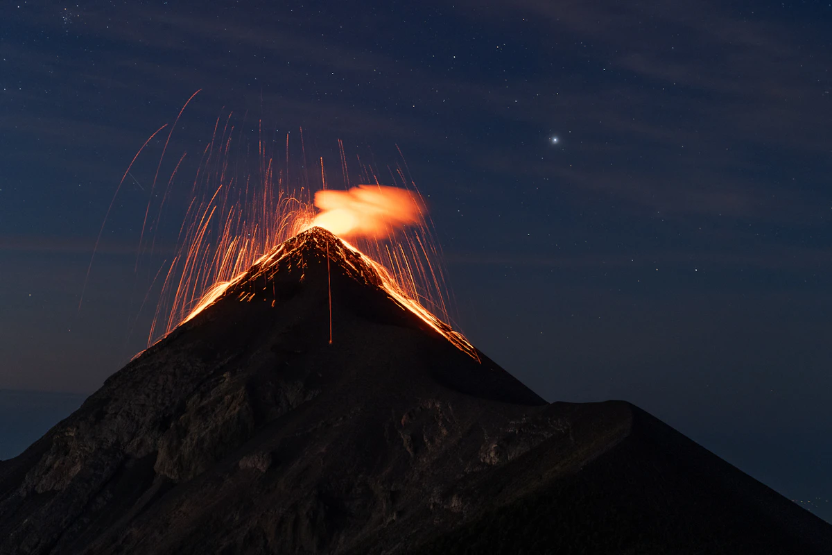 Acatenango volcano erupting at dusk in Guatemala