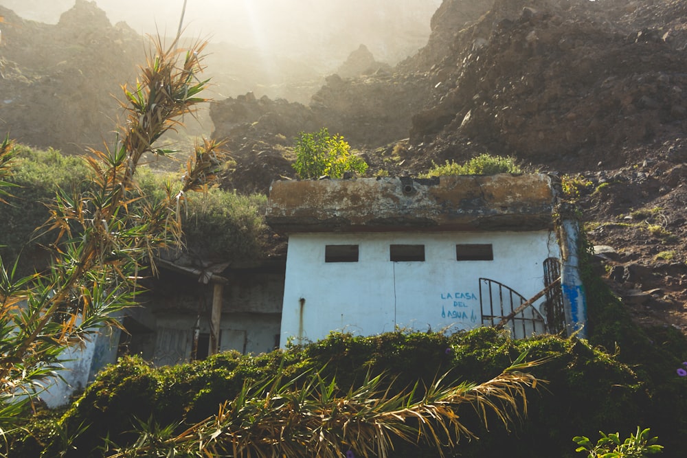 a blue house in the mountains