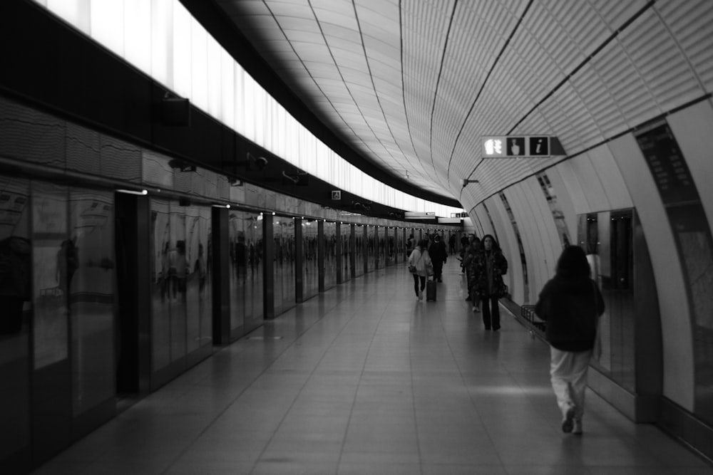 people walking in a train station