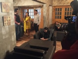 A diverse group of people playing interactive games in a modern living room.