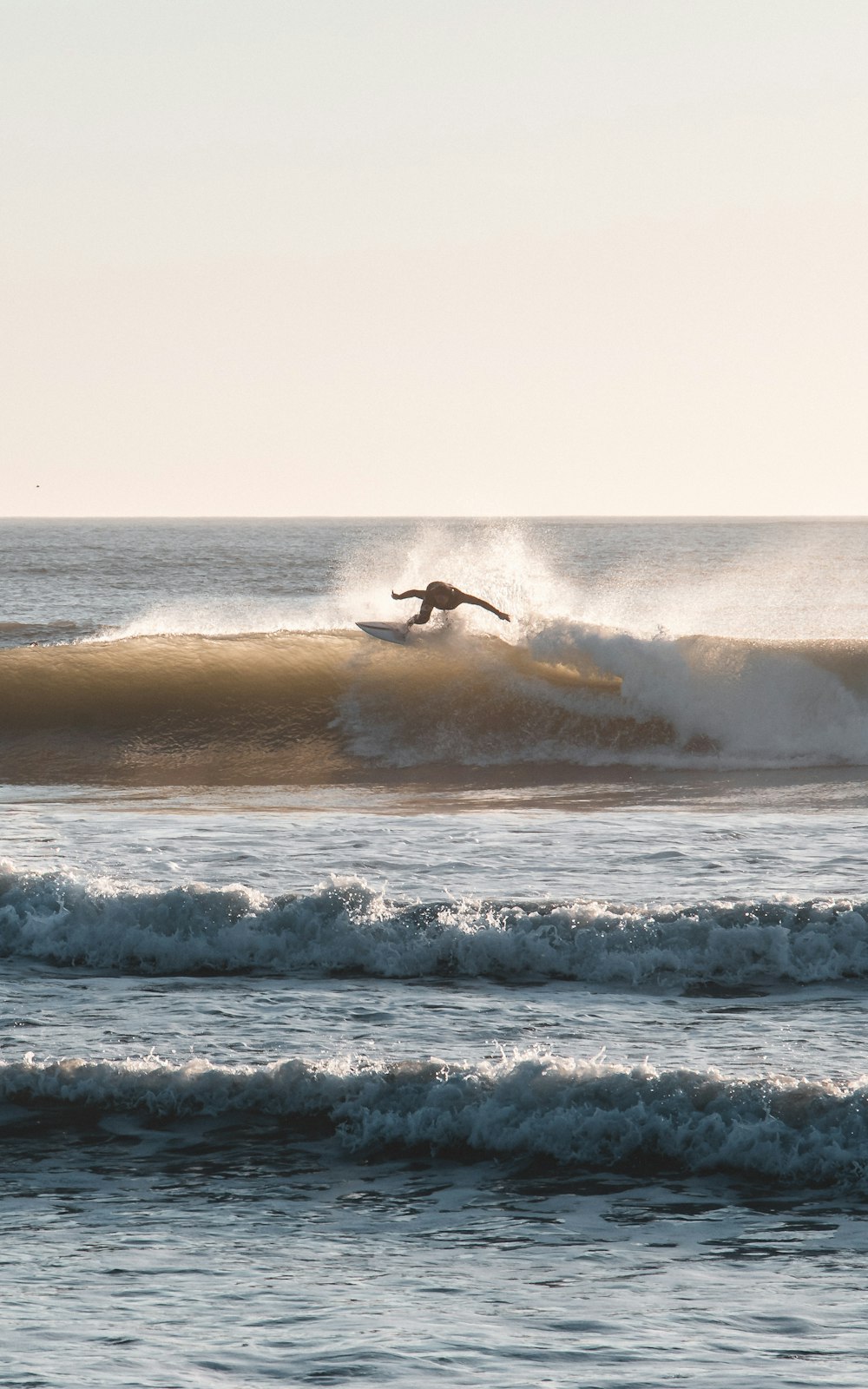 a person surfing on the waves