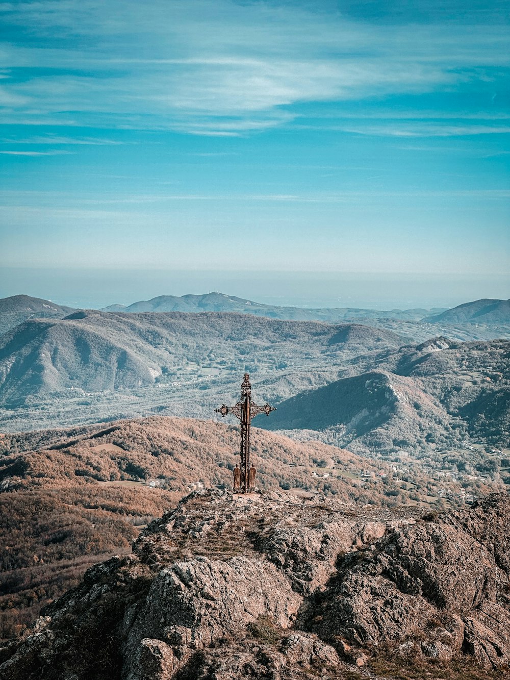 a cross on a mountain