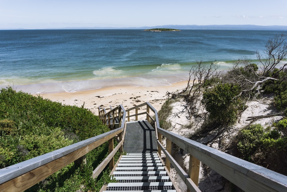 a beach with a railing