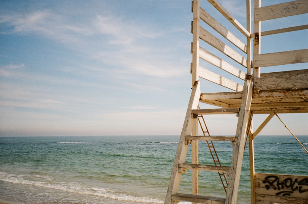 a wooden structure on a beach
