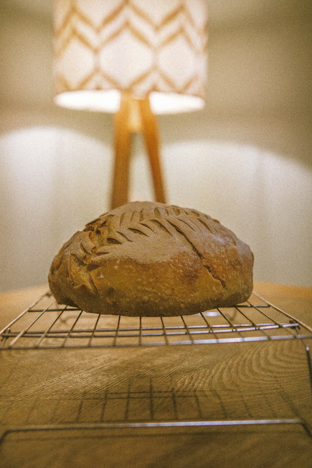 a loaf of bread on a cooling rack