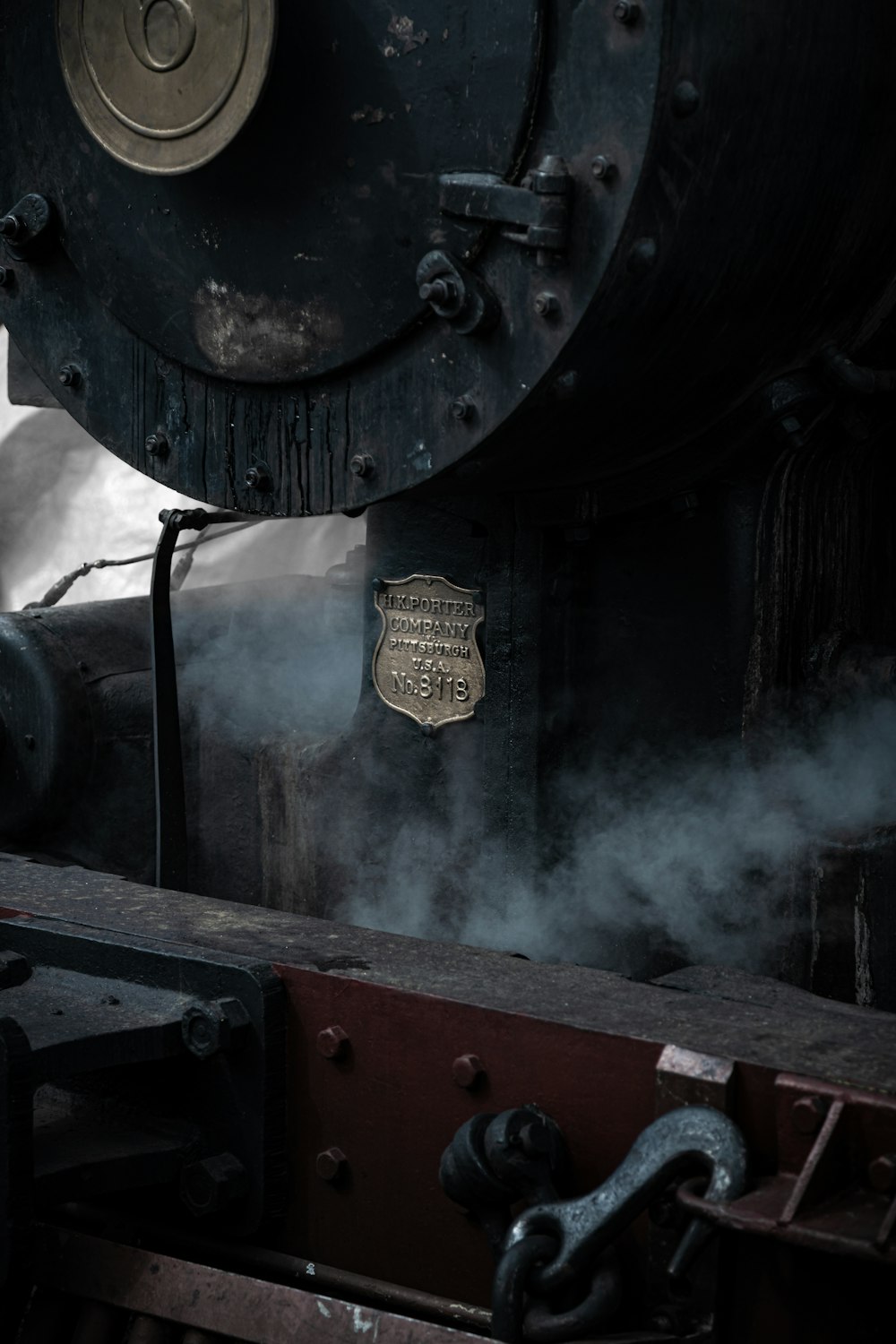 a train engine with steam coming out of it