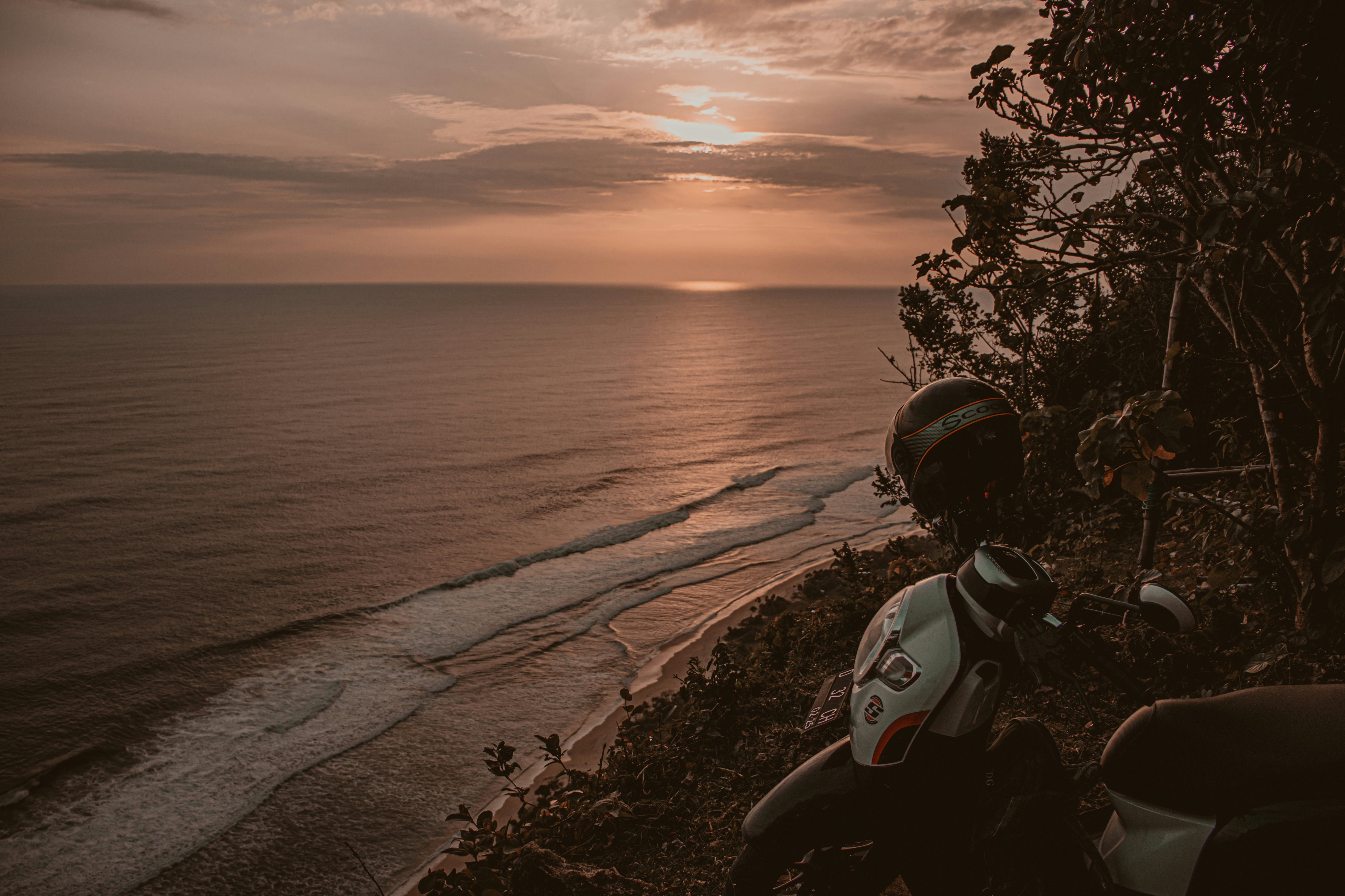 a motorcycle parked on a beach