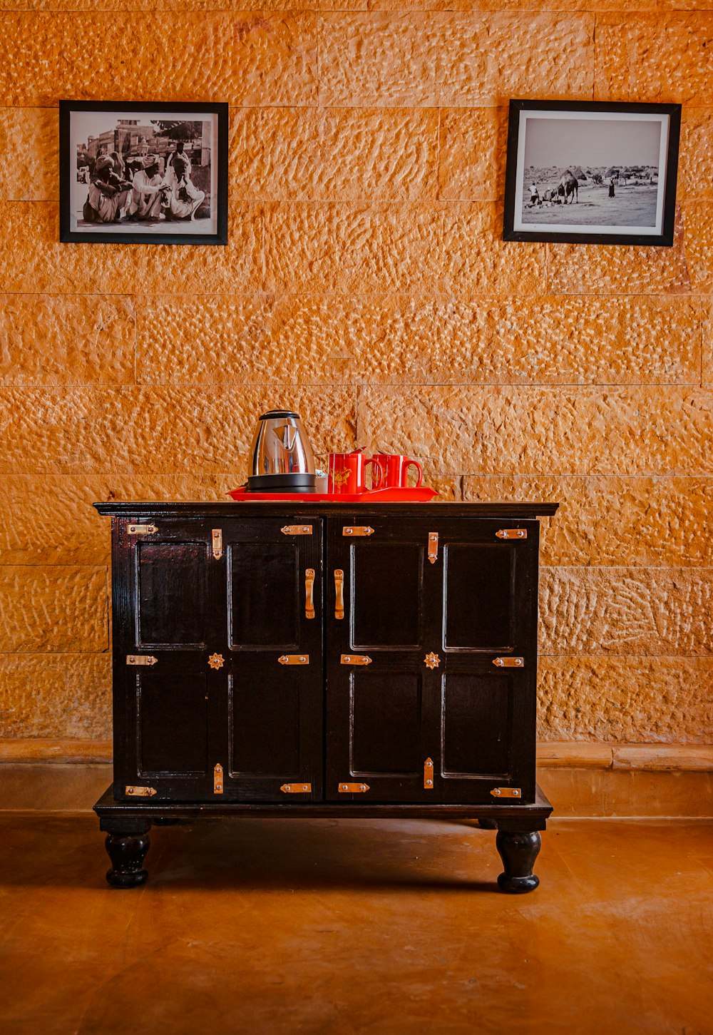 a black cabinet with a red top