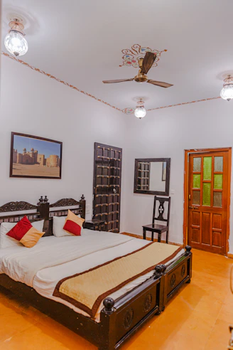 a bedroom with a bed and a chandelier