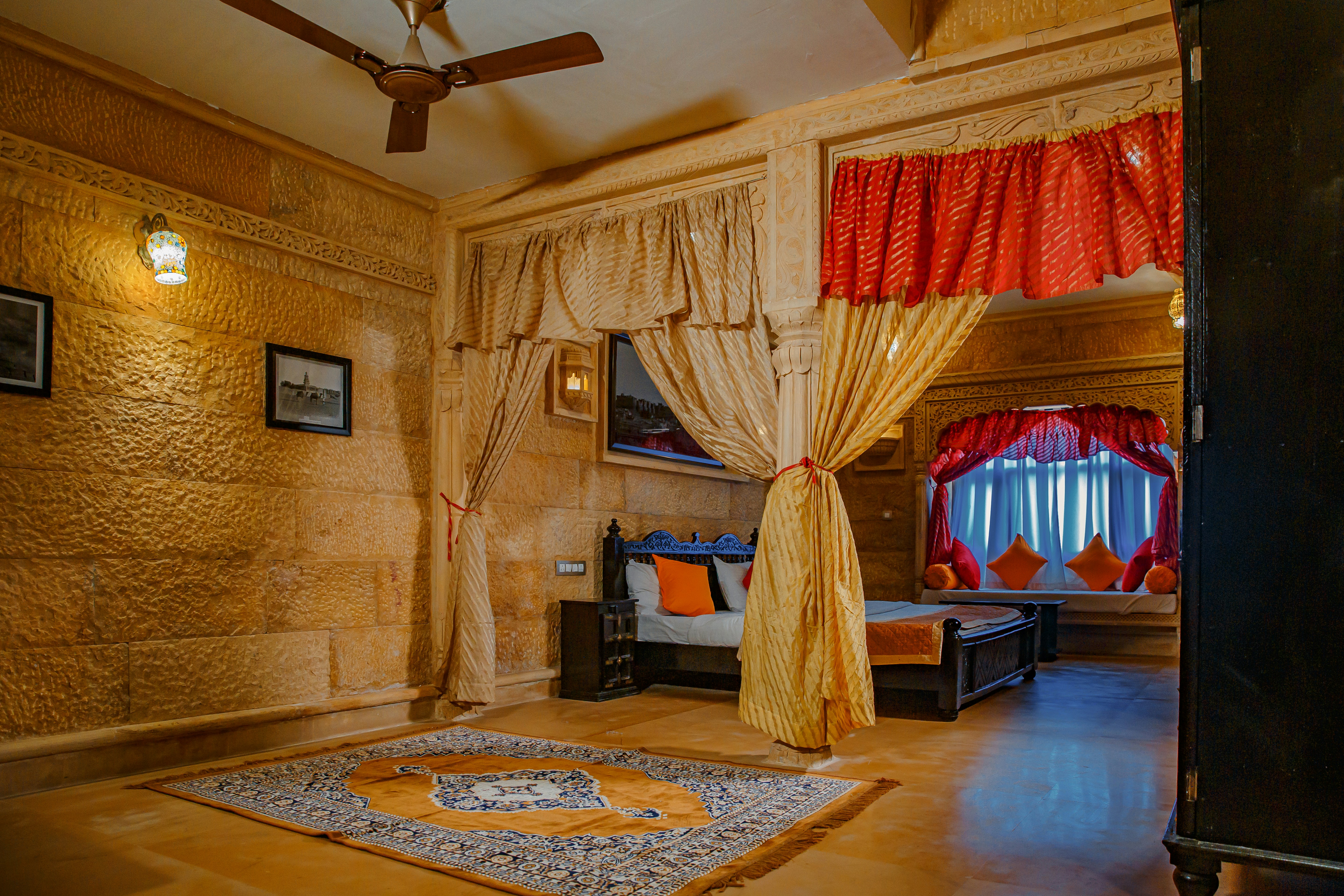 a bedroom with a bed and a fan