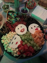 A display of assorted kawaii flancheese animals arranged on a minimalist white platter.