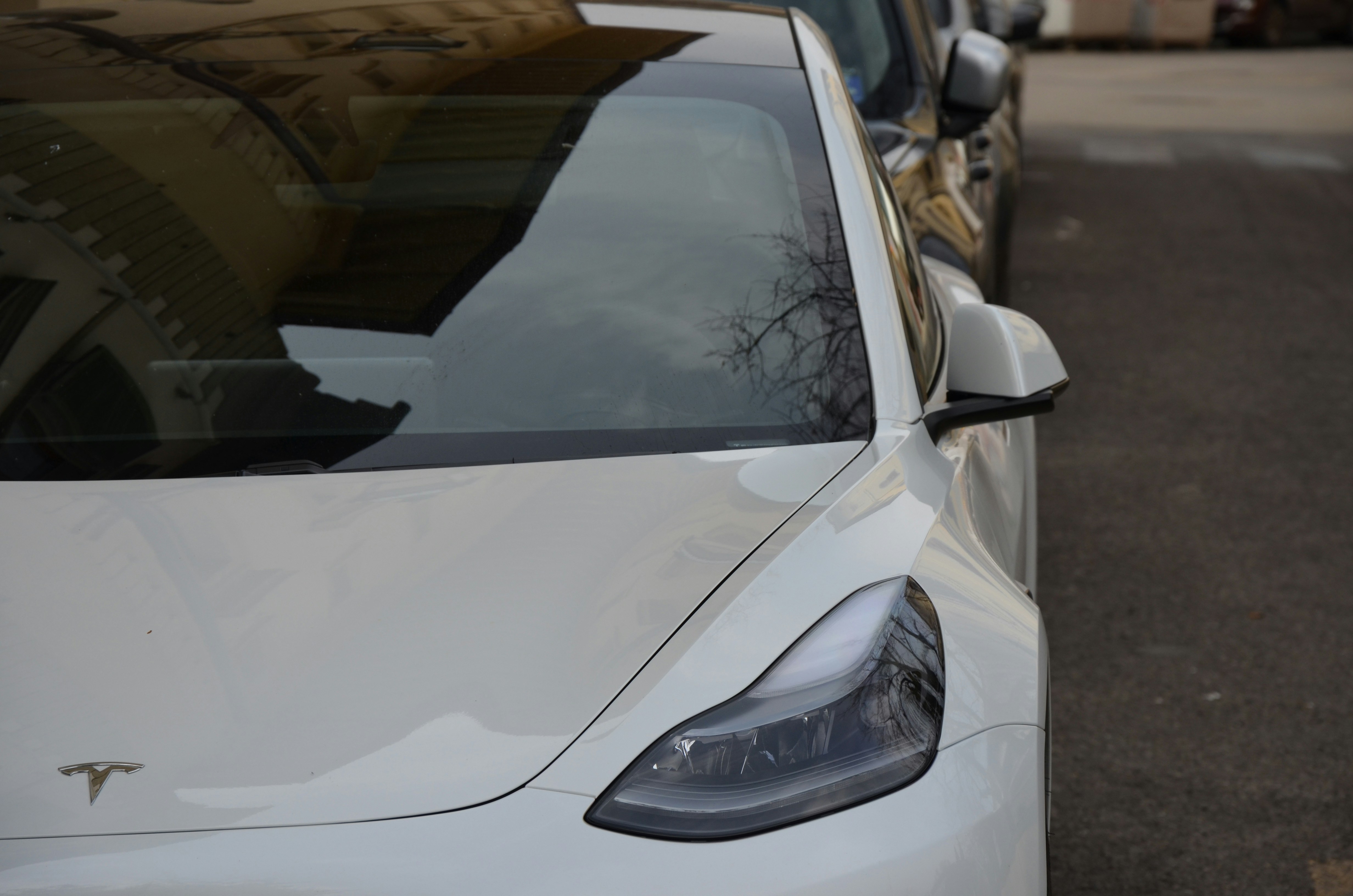 Row of modern used electric vehicles parked on a dealer-style lot