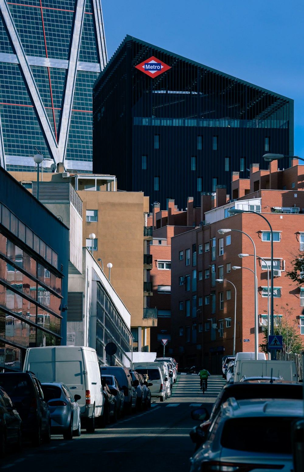 a street with cars and buildings on either side of it