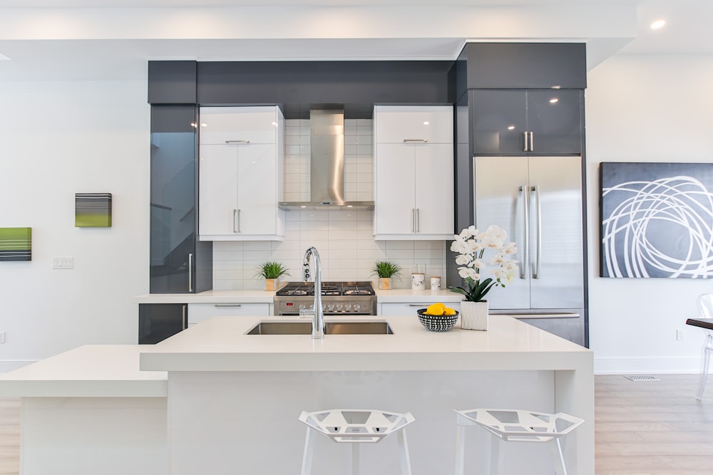 a kitchen with white cabinets