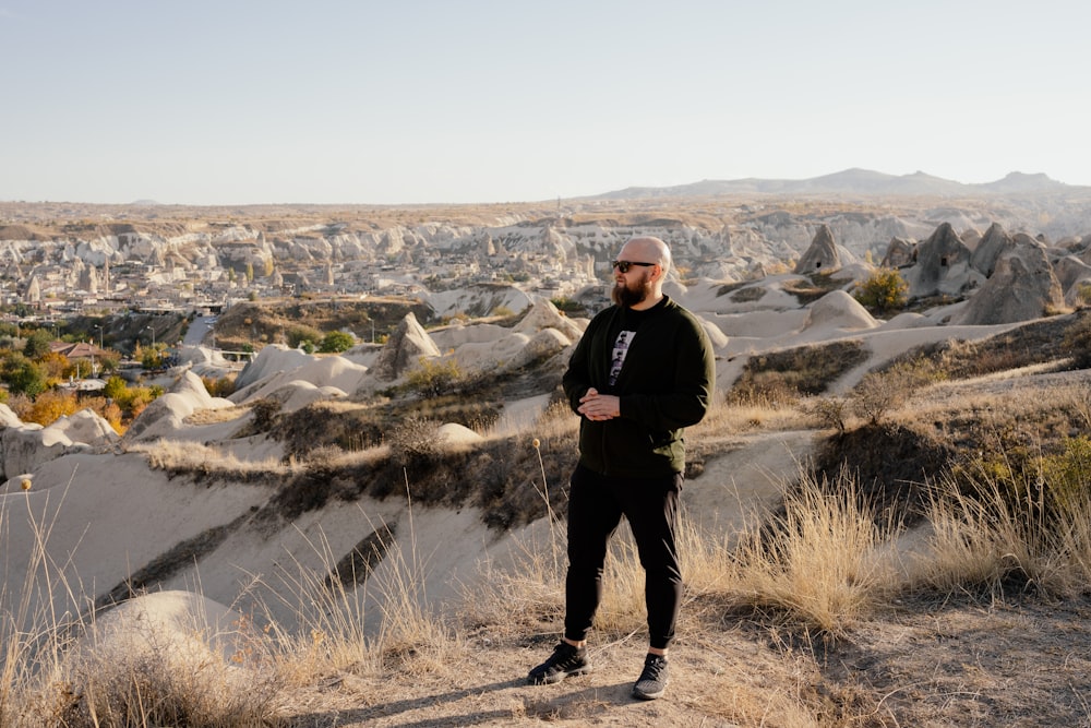 a man standing on a hill